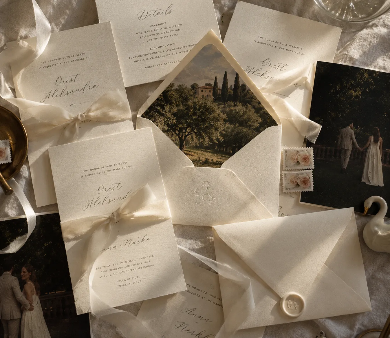 Ivory wedding invitations and envelopes tied with silk ribbon